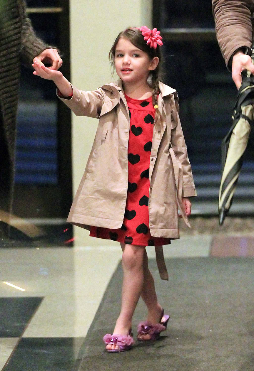 Suri Cruise gives paps a dirty look when heading out to 'Wicked' with mom Katie Holmes in NYC
